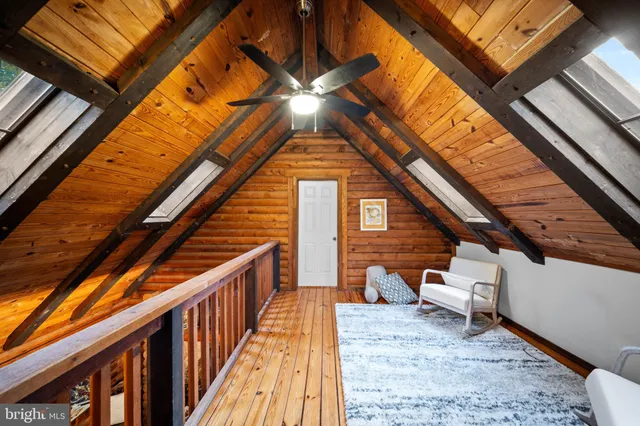 a view of a two chairs in the balcony