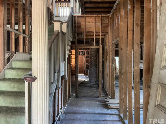a view of entryway door with wooden floor