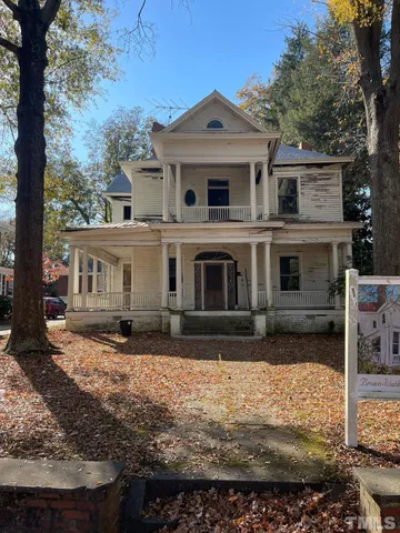 a front view of a house with yard