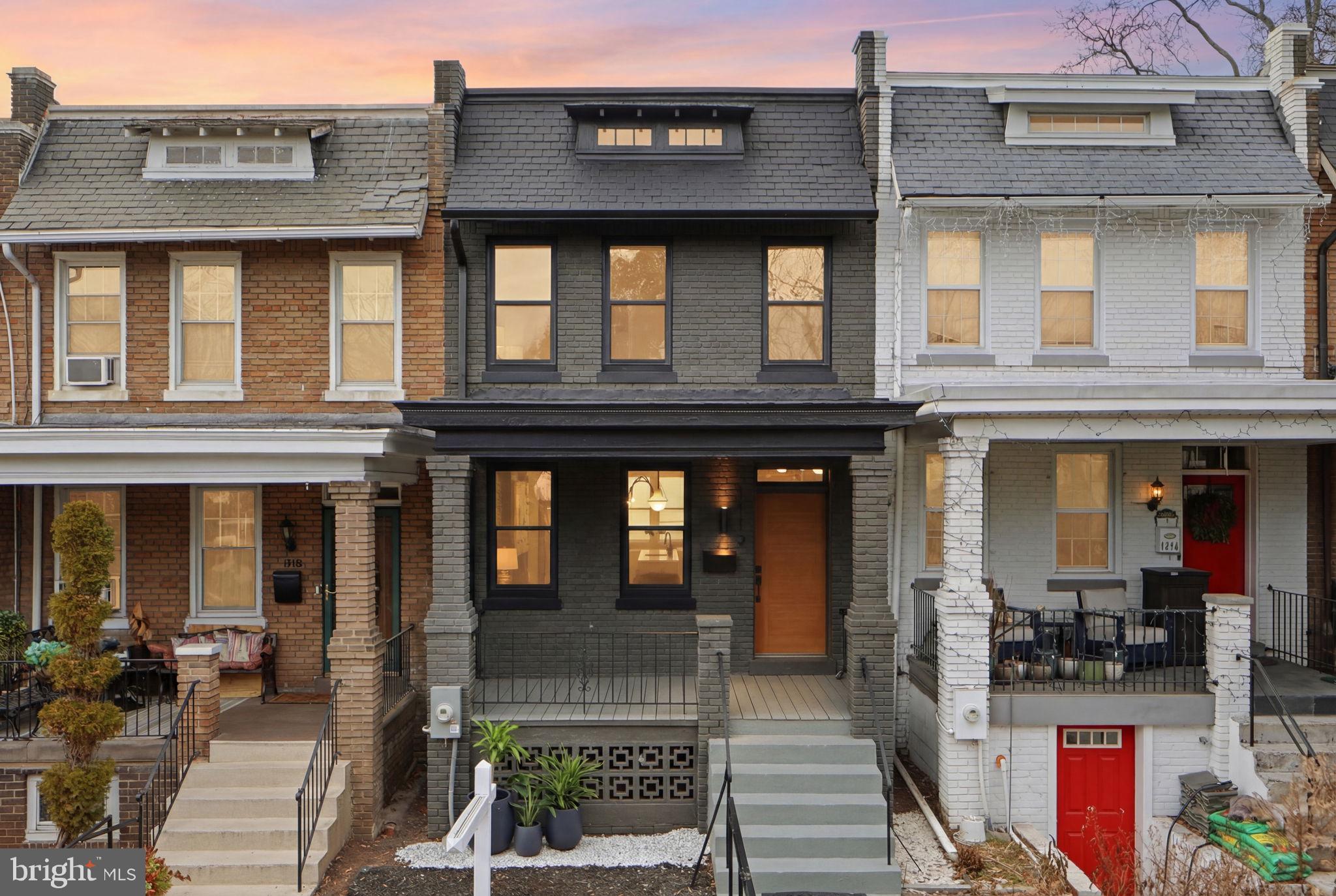 a front view of a building with outdoor seating