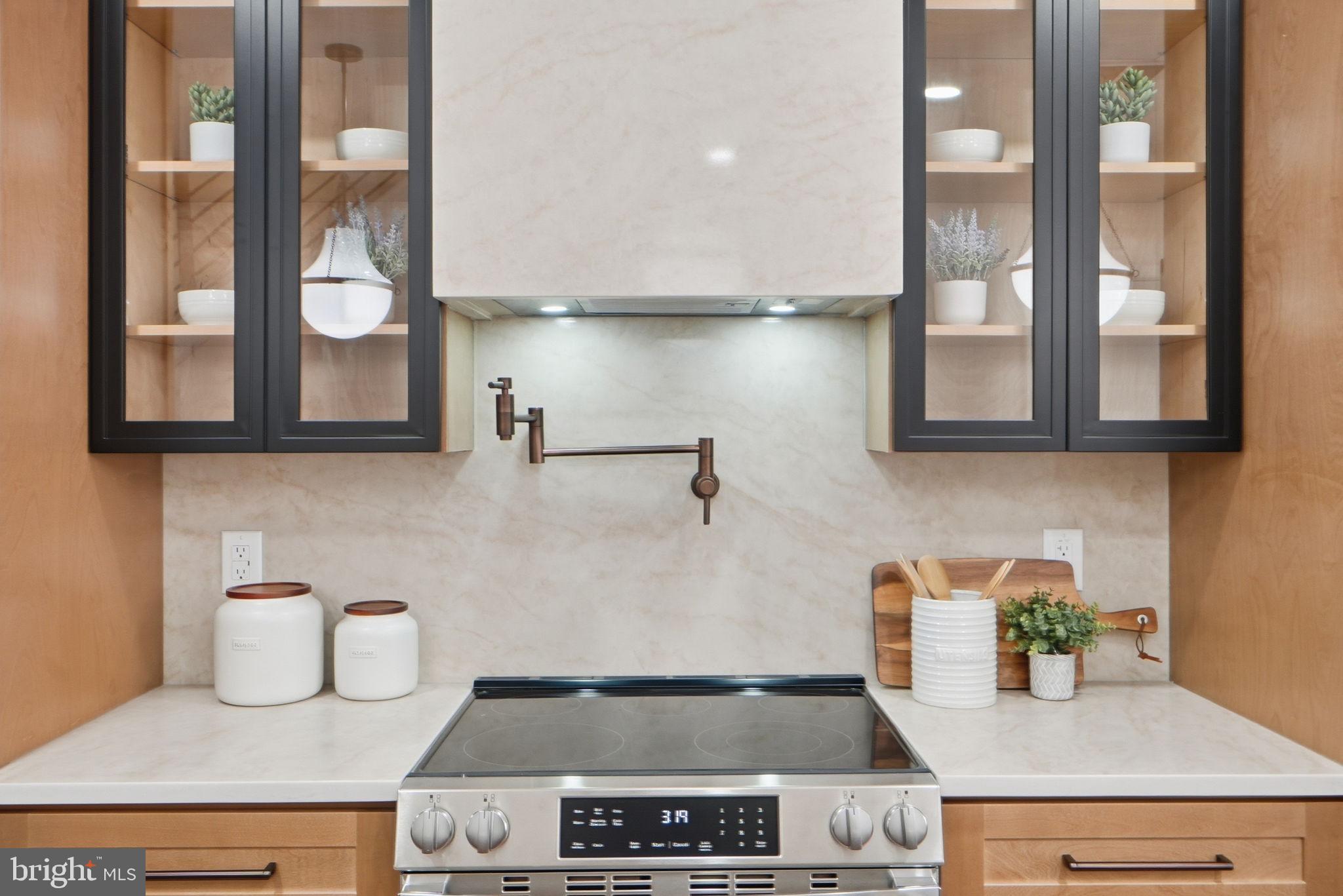 1412 Trinidad Avenue Northeast Washington, DC 20002 - Photo 16 of 47 a kitchen with a stove and cabinets