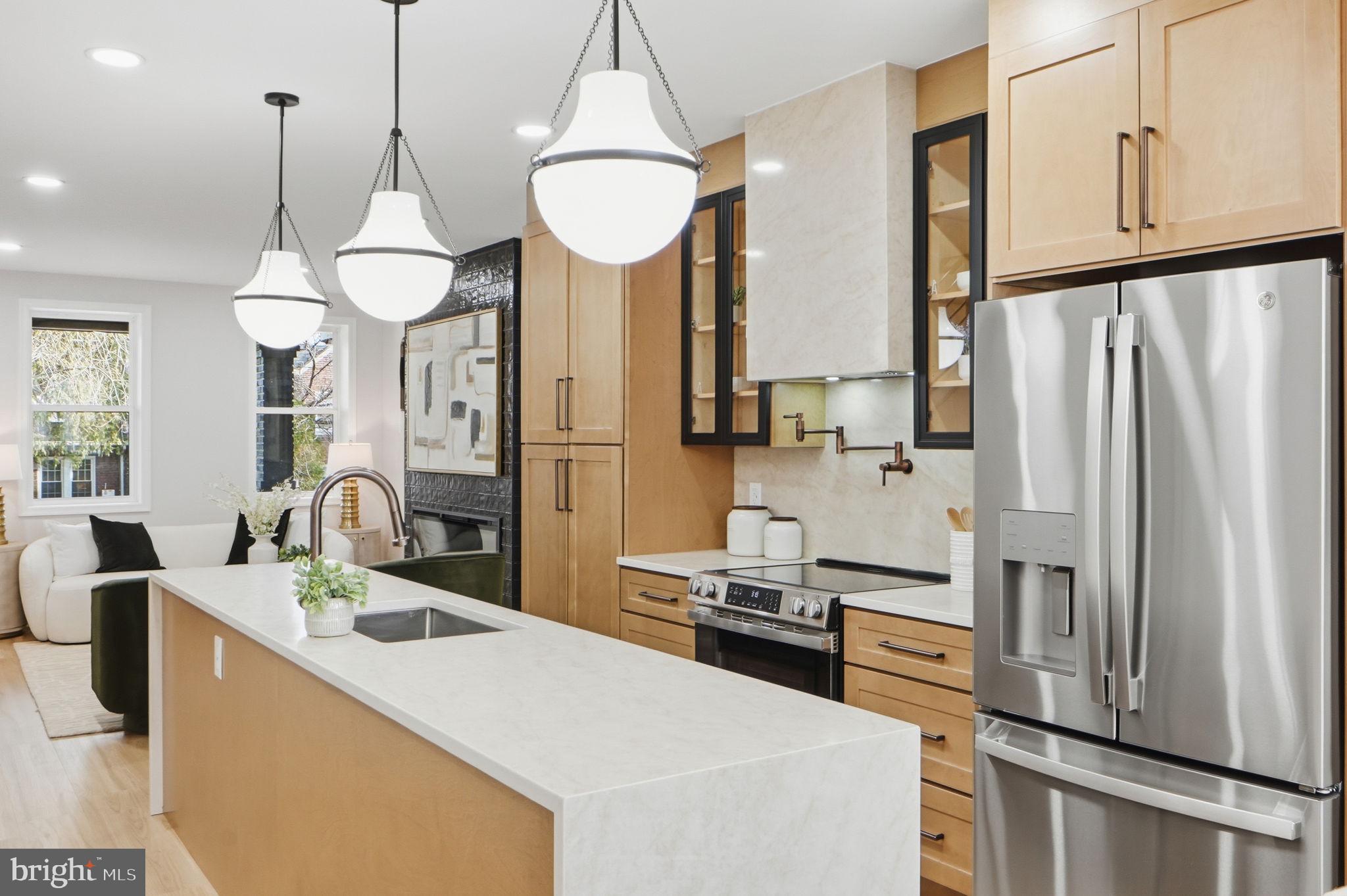 1412 Trinidad Avenue Northeast Washington, DC 20002 - Photo 17 of 47 a kitchen with stainless steel appliances a sink stove and refrigerator