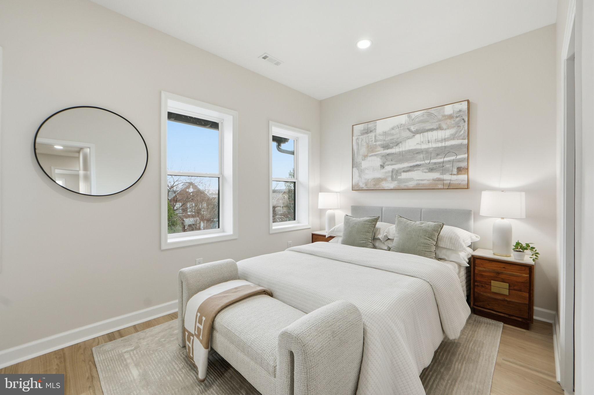1412 Trinidad Avenue Northeast Washington, DC 20002 - Photo 23 of 47 a bedroom with a bed and a lamp