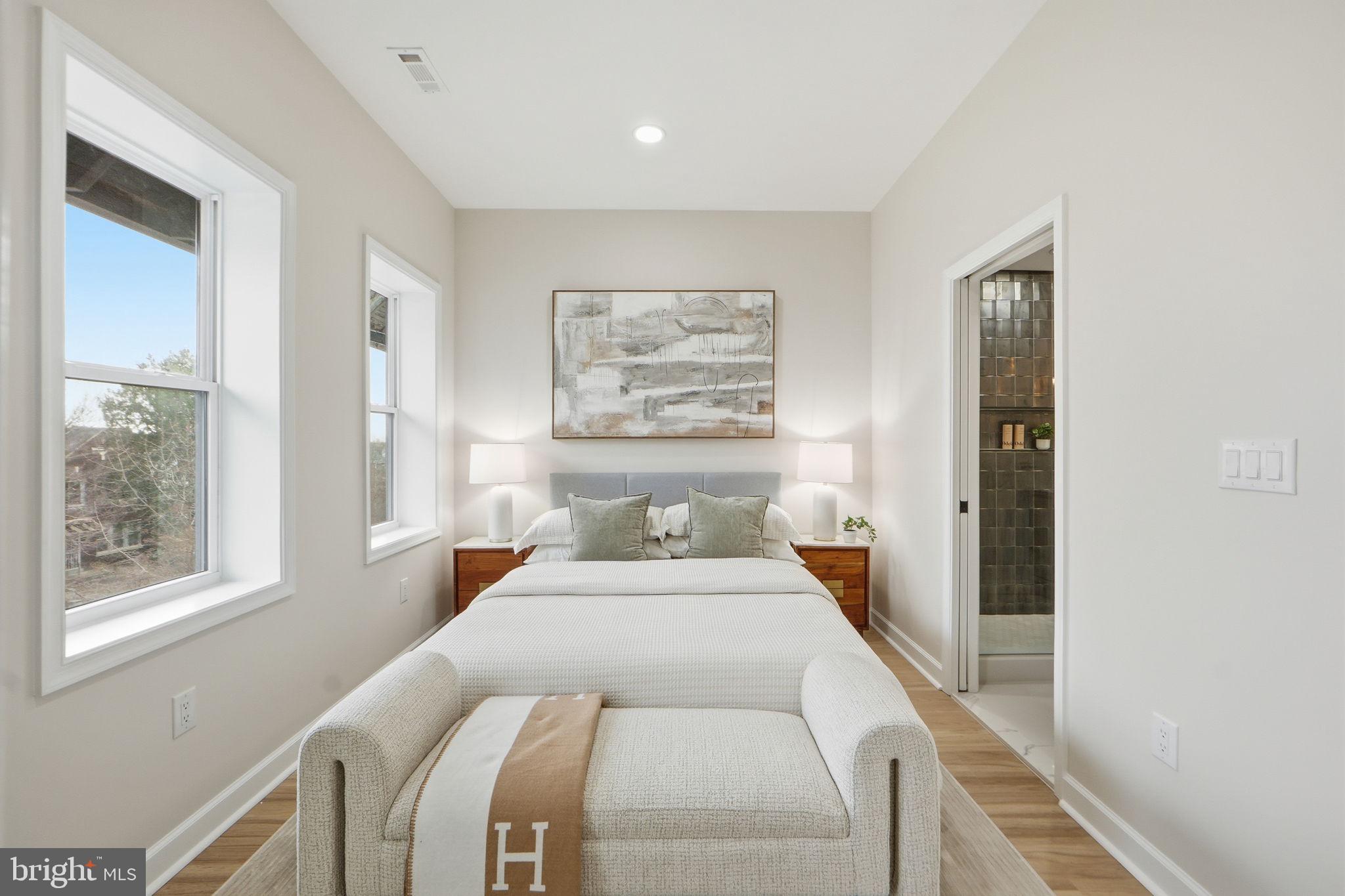 1412 Trinidad Avenue Northeast Washington, DC 20002 - Photo 24 of 47 a bedroom with a large bed and a window