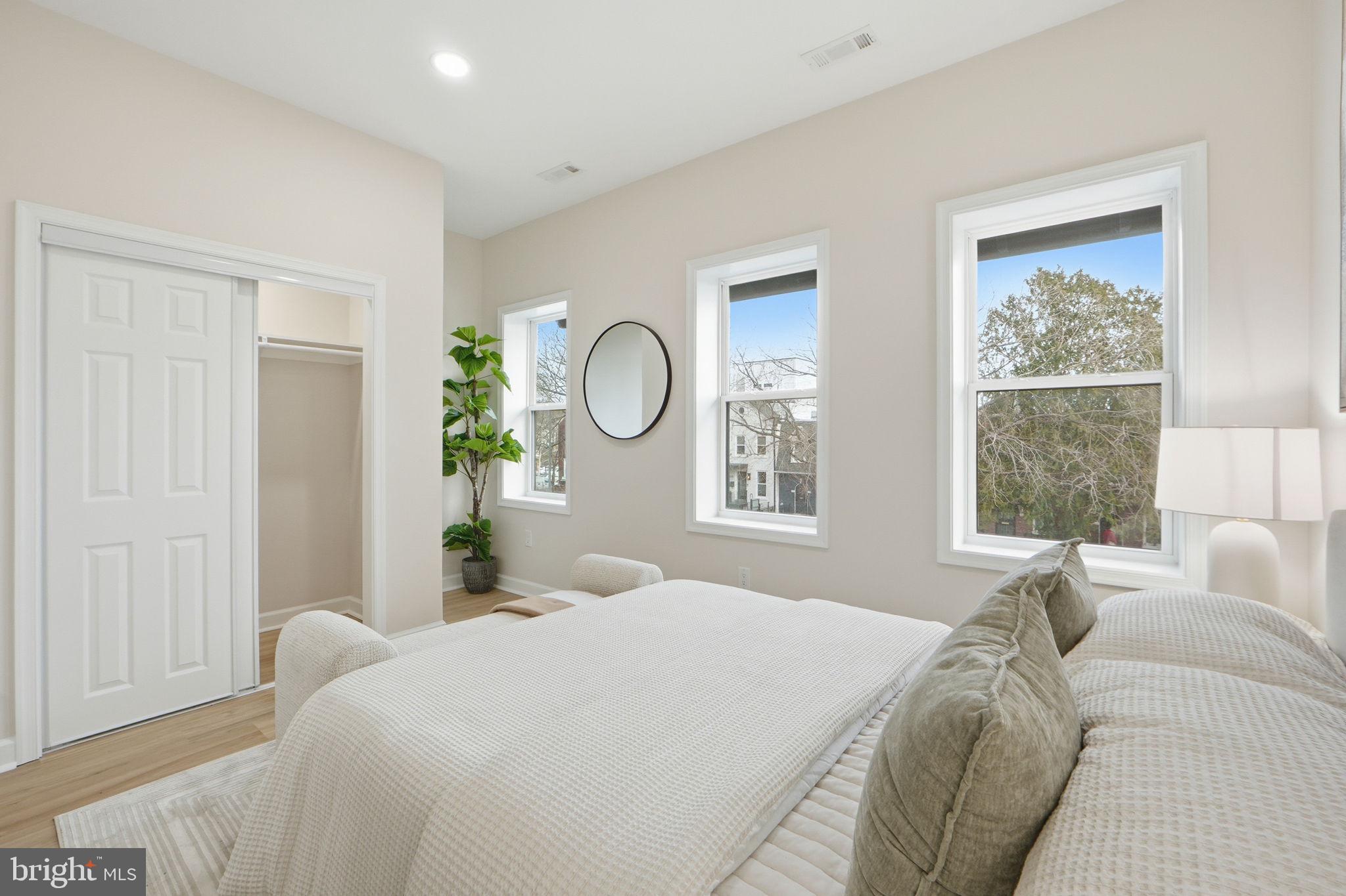 1412 Trinidad Avenue Northeast Washington, DC 20002 - Photo 26 of 47 a living room with a bed furniture and a window