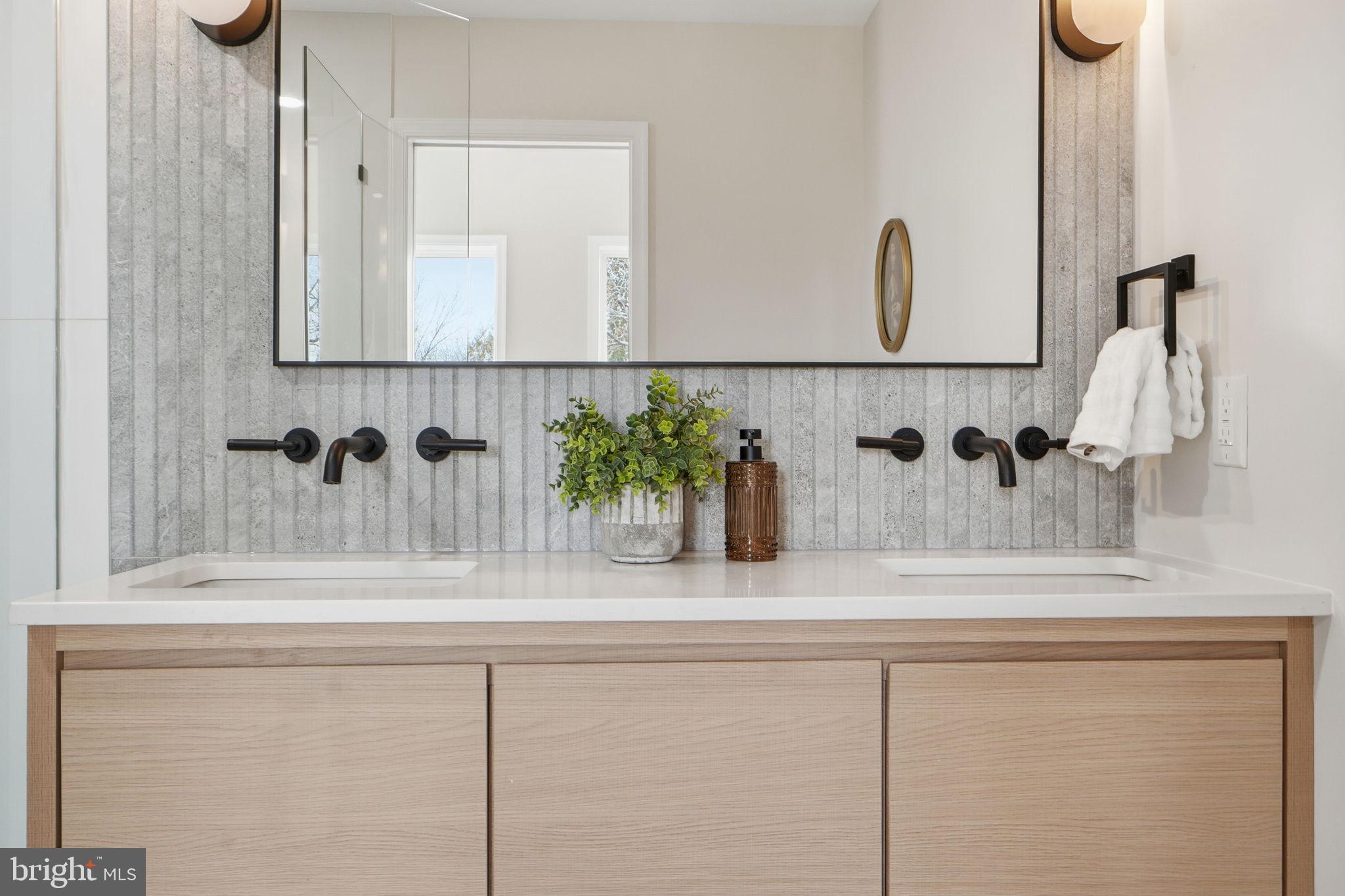 1412 Trinidad Avenue Northeast Washington, DC 20002 - Photo 30 of 47 a bathroom with a sink and a mirror