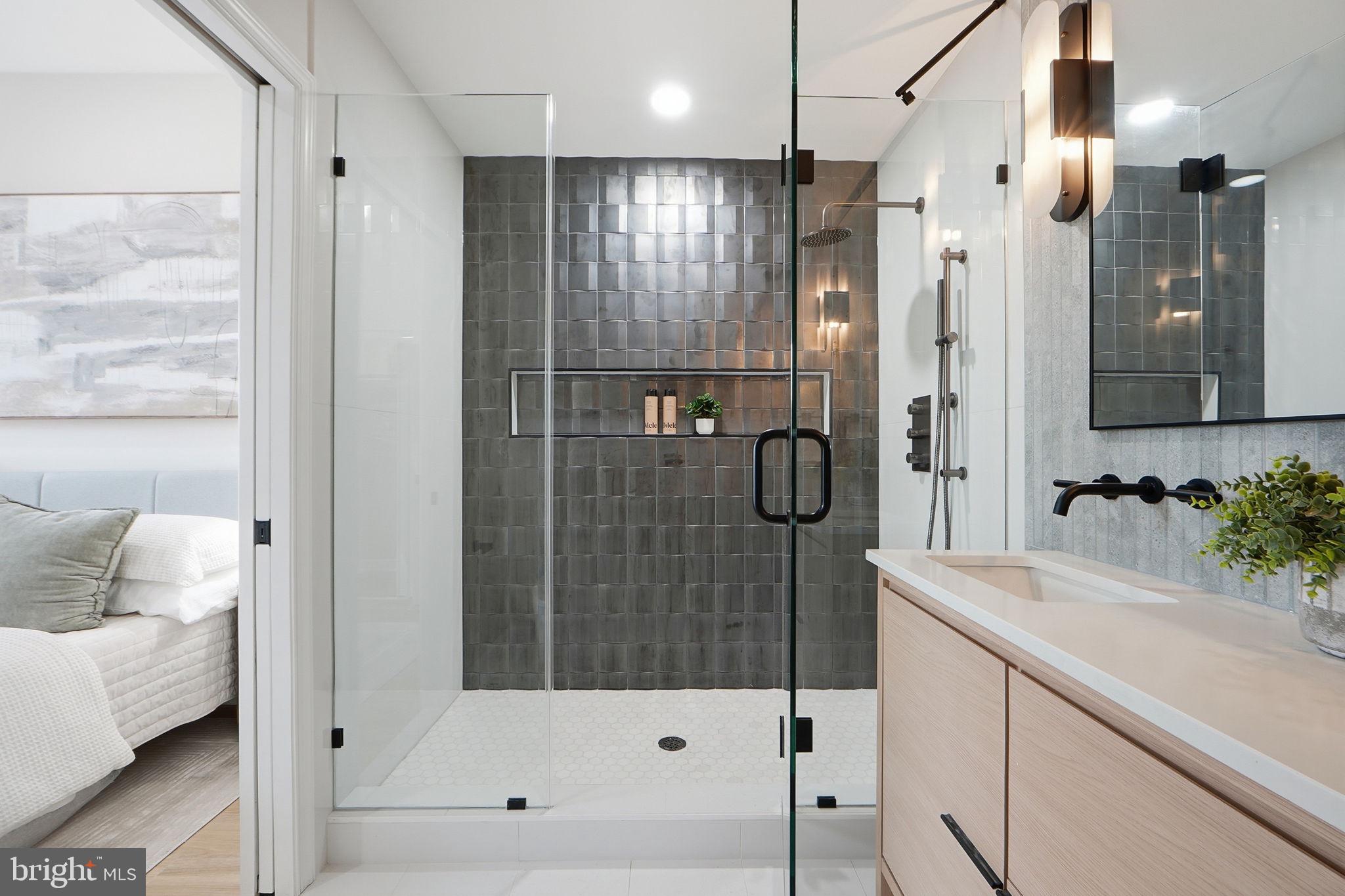 1412 Trinidad Avenue Northeast Washington, DC 20002 - Photo 31 of 47 a bathroom with a shower sink and mirror