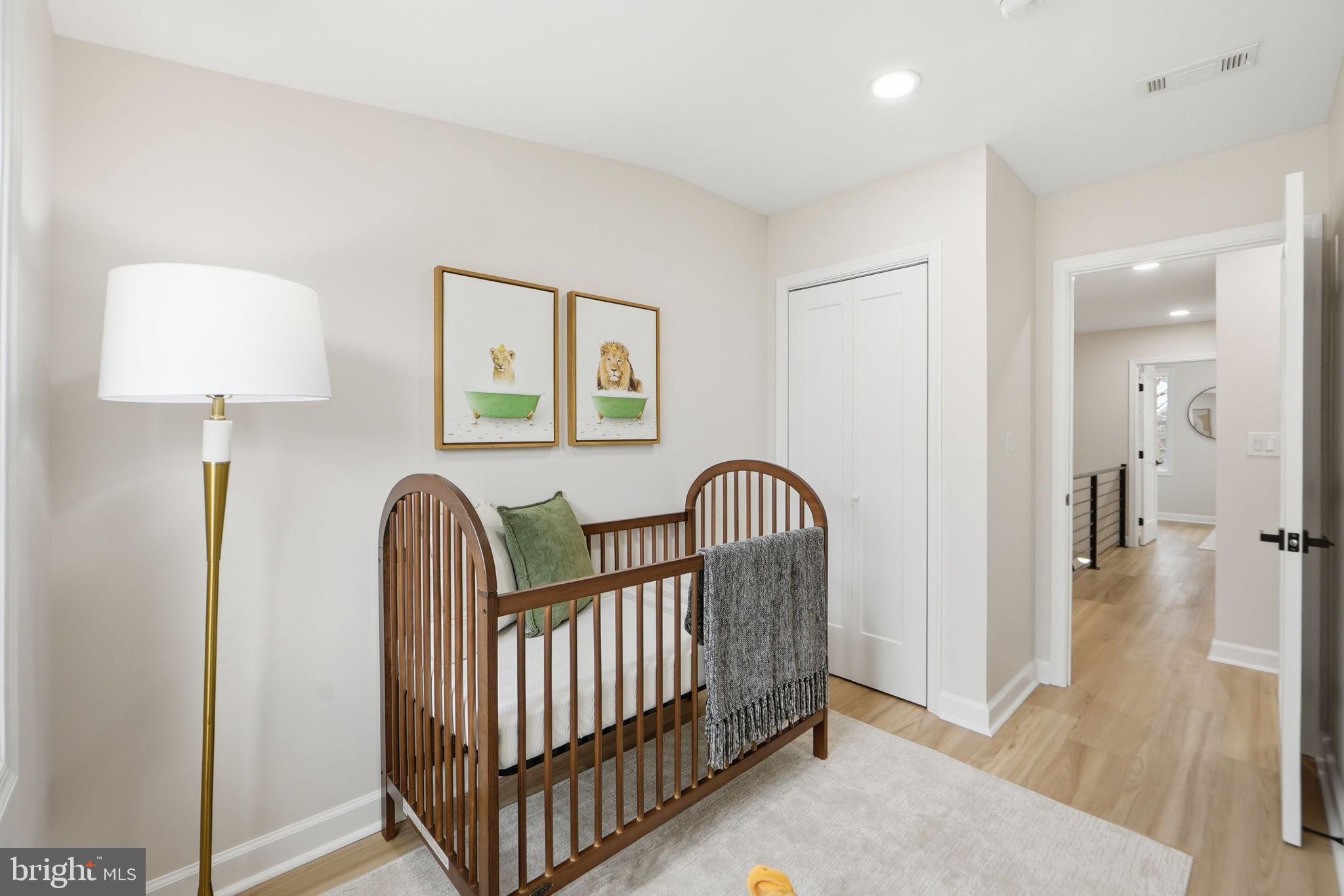 1412 Trinidad Avenue Northeast Washington, DC 20002 - Photo 34 of 47 a view of a hallway to a livingroom with wooden floor and furniture