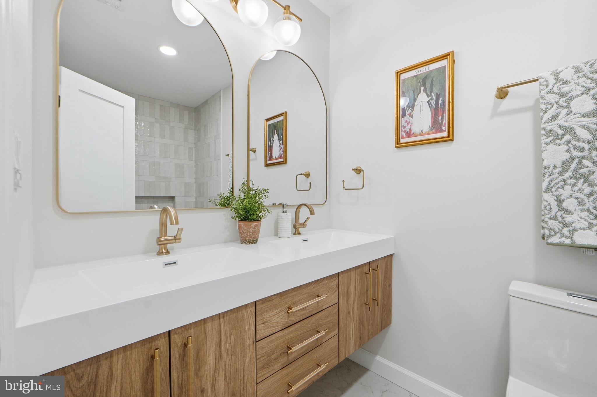 1412 Trinidad Avenue Northeast Washington, DC 20002 - Photo 35 of 47 a bathroom with a sink mirror and vanity
