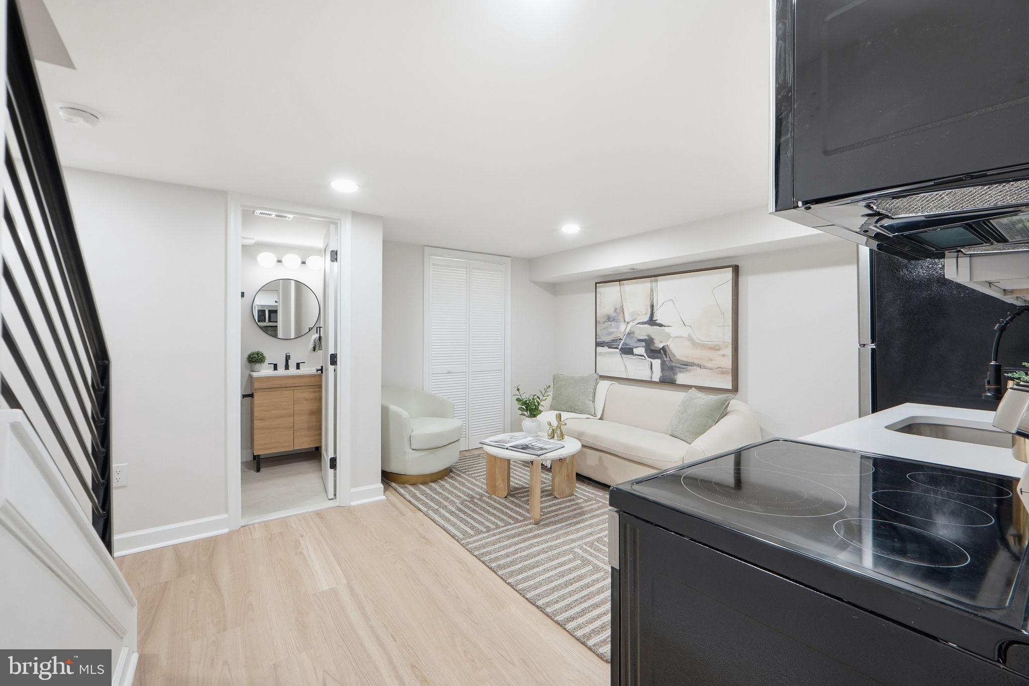 1412 Trinidad Avenue Northeast Washington, DC 20002 - Photo 44 of 47 a living room with furniture and a flat screen tv