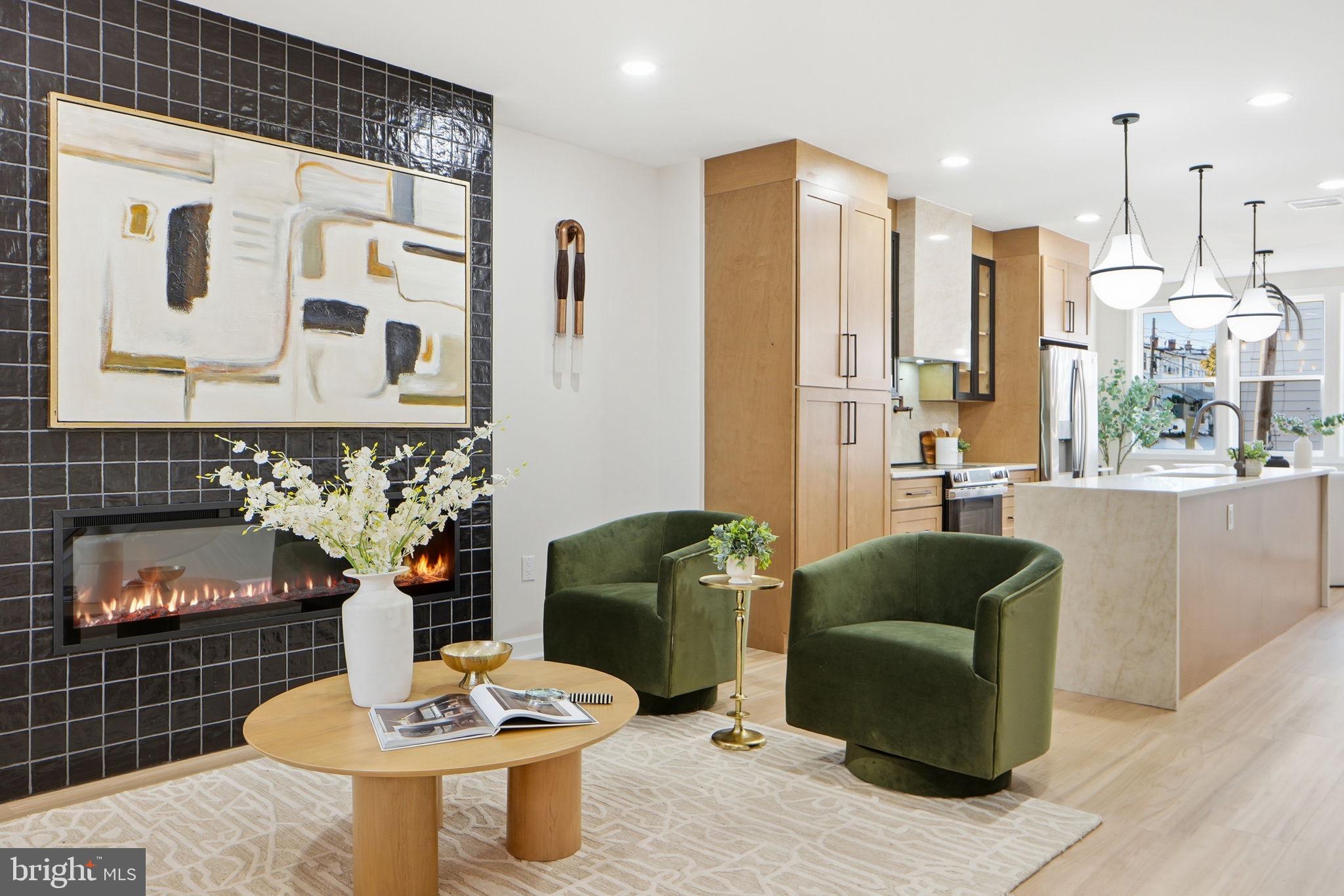 1412 Trinidad Avenue Northeast Washington, DC 20002 - Photo 5 of 47 a living room with furniture kitchen view and a fireplace
