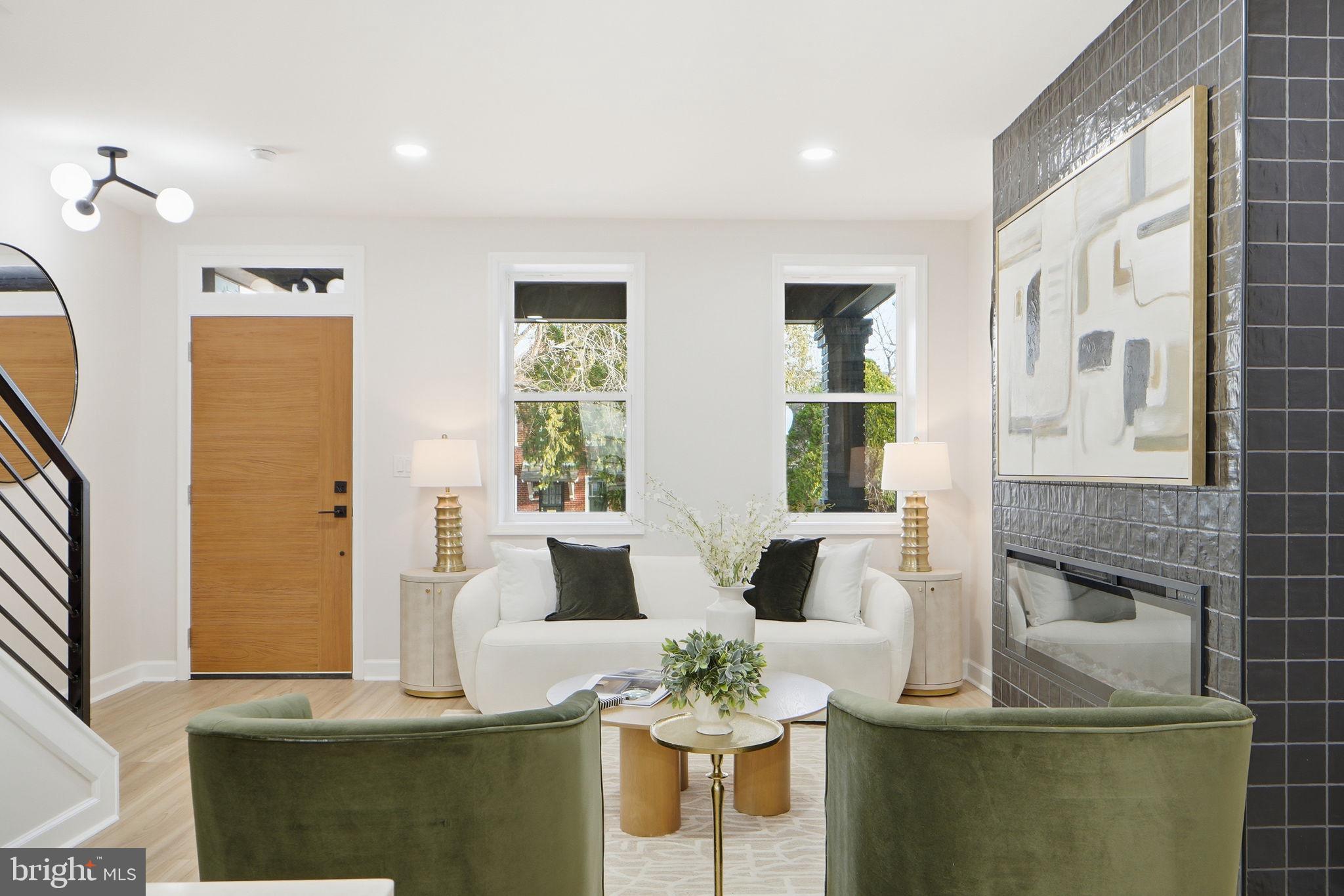 1412 Trinidad Avenue Northeast Washington, DC 20002 - Photo 7 of 47 a living room with fireplace furniture and a potted plant