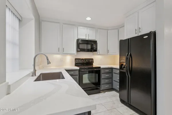 a kitchen with a refrigerator stove and a sink