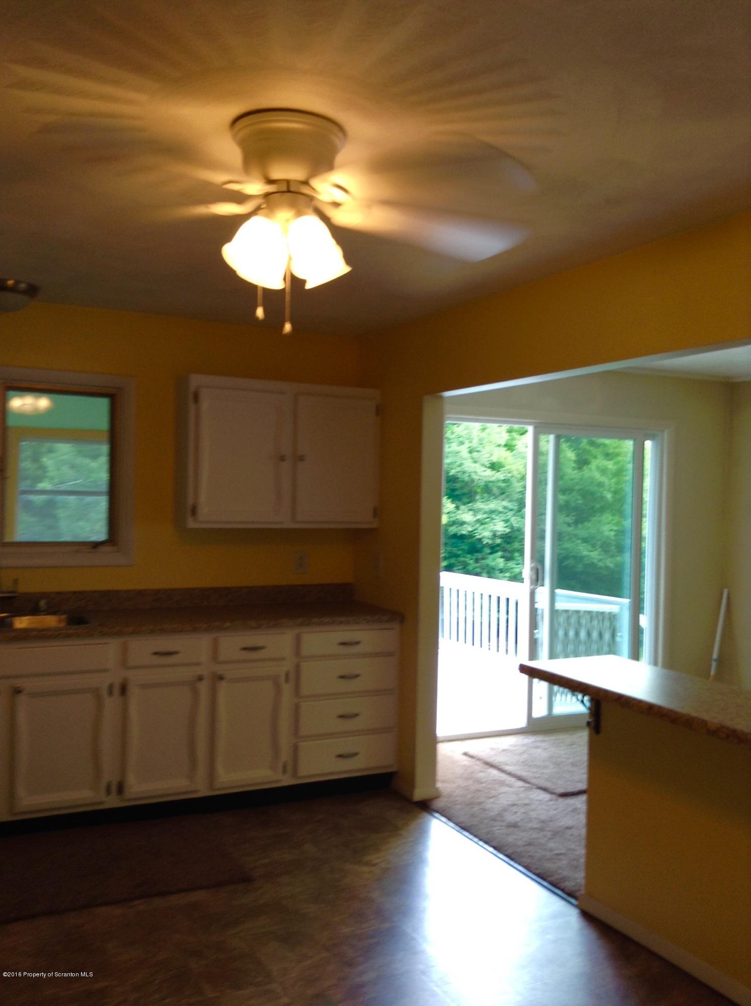 2658 North Road Montrose, PA 18801 - Photo 6 of 25 a view of a livingroom with wooden floor and a ceiling fan
