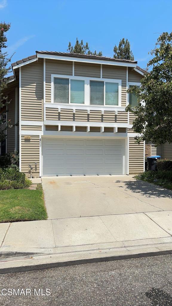12015 River Grove Court Moorpark, CA 93021 - Photo 1 of 33 a front view of a house with a yard