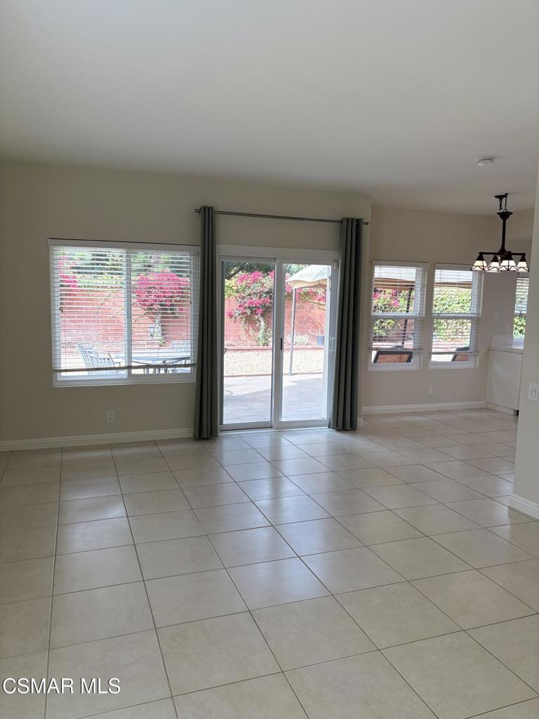 12015 River Grove Court Moorpark, CA 93021 - Photo 12 of 33 a view of an empty room with window and chandelier fan
