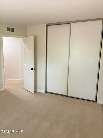 a bathroom with a granite countertop sink a toilet and a bathtub