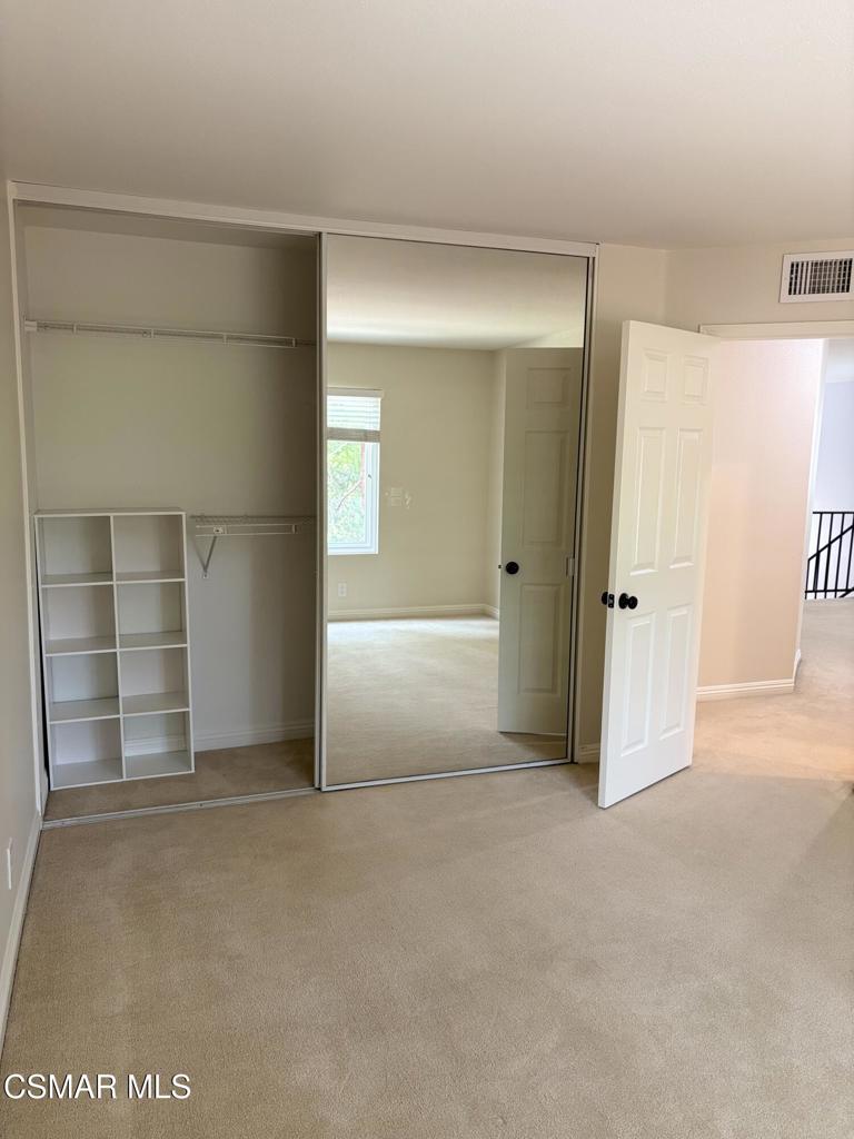 12015 River Grove Court Moorpark, CA 93021 - Photo 17 of 33 an empty room with closet and windows