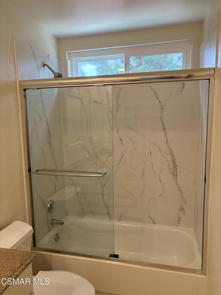 12015 River Grove Court Moorpark, CA 93021 - Photo 19 of 33 a bathroom with a shower and a toilet