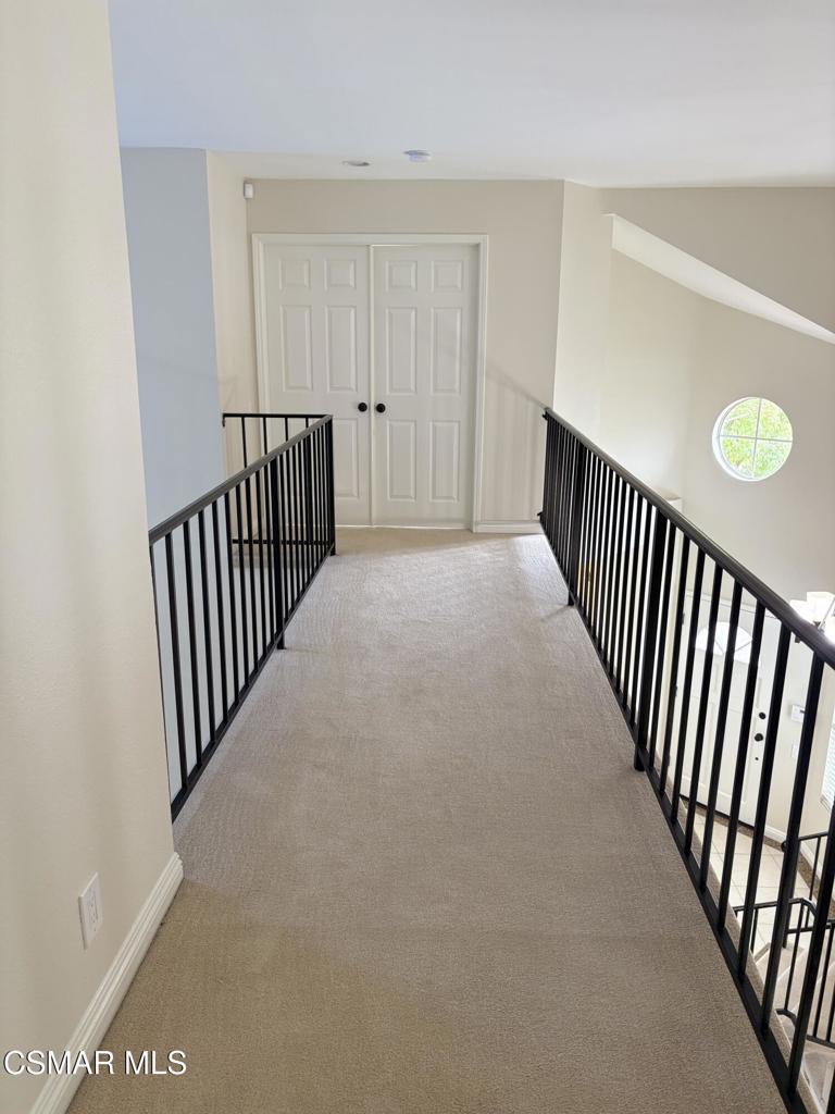 12015 River Grove Court Moorpark, CA 93021 - Photo 20 of 33 a view of a hallway with stairs