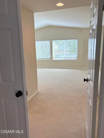 a bathroom with a granite countertop sink a mirror and shower