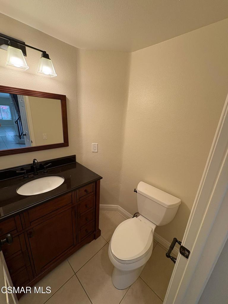 12015 River Grove Court Moorpark, CA 93021 - Photo 4 of 33 a bathroom with a sink and a toilet