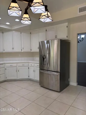a kitchen with stainless steel appliances granite countertop a sink and a stove