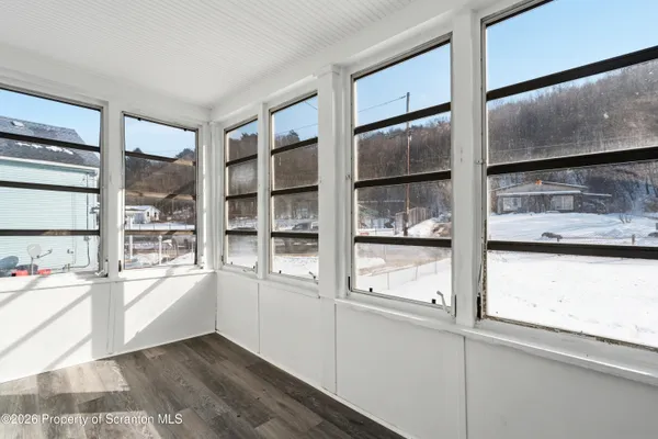 a view of an empty room and window
