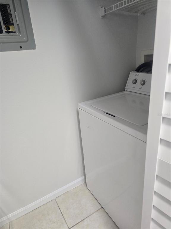 4316 South Kirkman Road, Unit 1608 Orlando, FL 32811 - Photo 14 of 16 a utility room with dryer and washer