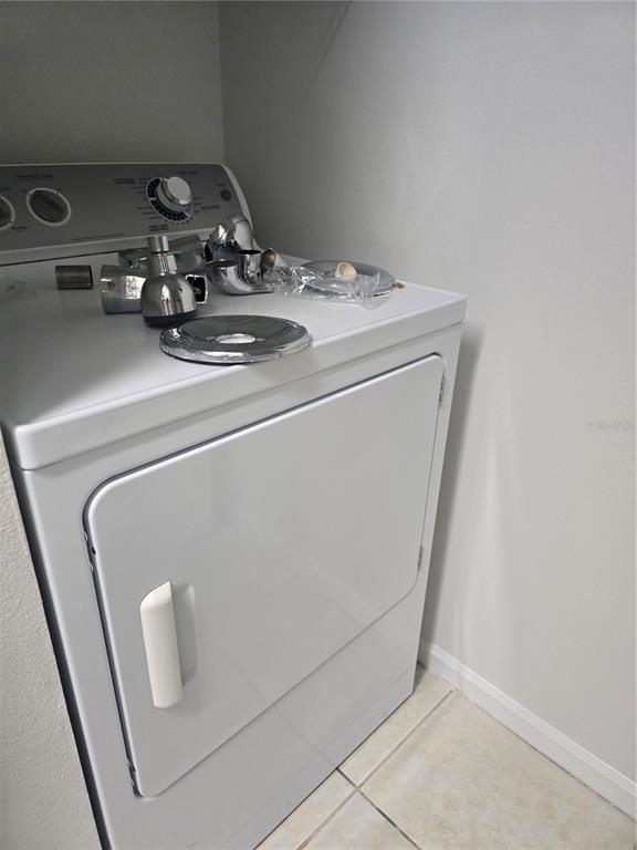 4316 South Kirkman Road, Unit 1608 Orlando, FL 32811 - Photo 15 of 16 a utility room with dryer and washer