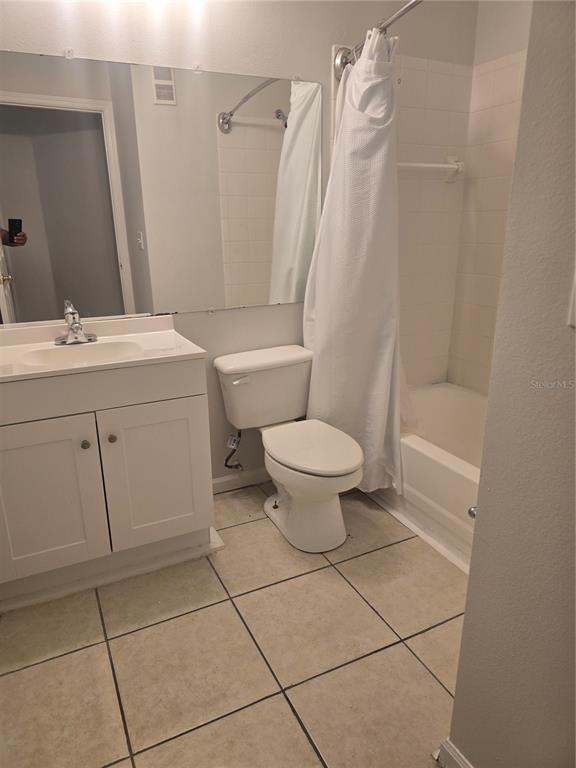 4316 South Kirkman Road, Unit 1608 Orlando, FL 32811 - Photo 6 of 16 a bathroom with a sink toilet and shower