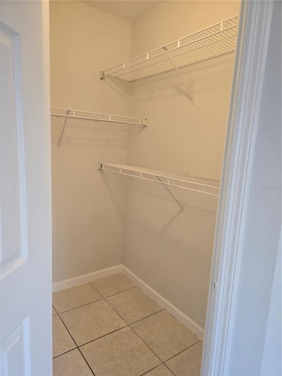 4316 South Kirkman Road, Unit 1608 Orlando, FL 32811 - Photo 9 of 16 a view of a room with racks on the wall