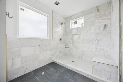 a picture of a bench in front of a house