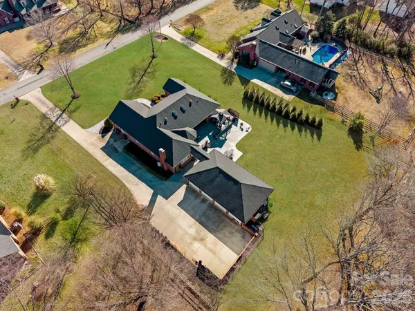 a view of a backyard with sitting area