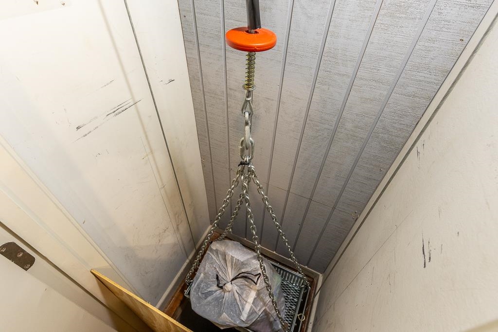 9382 Riveredge Drive Memphis, TN 38018 - Photo 38 of 40 PULL INTO YOUR GARAGE, UNLOAD GROCERIES INTO THE DUMB WAITER AND SEND TO THE KITCHEN! NO BAGS TO CARRY UP STAIRS!