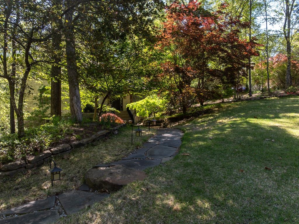 9382 Riveredge Drive Memphis, TN 38018 - Photo 4 of 40 There are several flagstone walks and stone terracing.