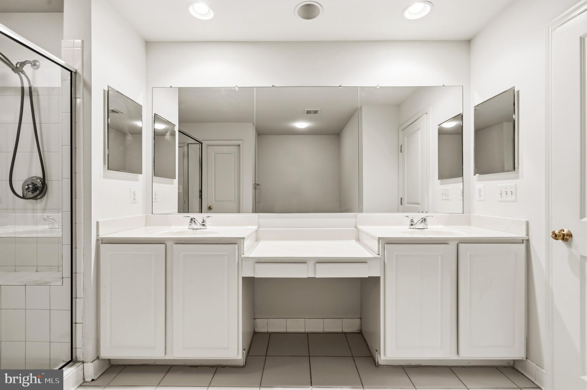 9227 Ribbon Falls Loop Bristow, VA 20136 - Photo 38 of 53 a bathroom with a sink double vanity and a mirror