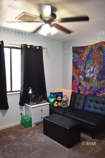 321 East Wilson Avenue Ridgecrest, CA 93555 - Photo 12 of 16 a living room with furniture and a flat screen tv