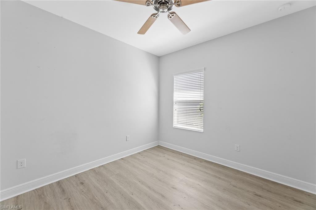 3711 Canopy Circle Naples, FL 34120 - Photo 14 of 28 an empty room with a window and a ceiling fan