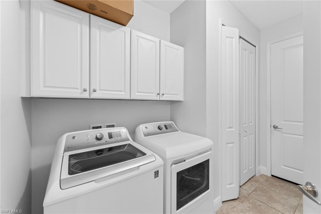 3711 Canopy Circle Naples, FL 34120 - Photo 24 of 28 a utility room with dryer and washer