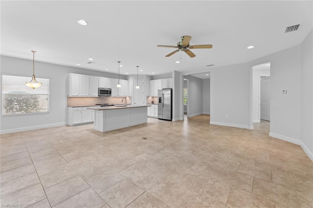 3711 Canopy Circle Naples, FL 34120 - Photo 4 of 28 a view of a kitchen with a sink and cabinets
