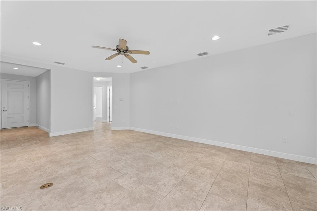 3711 Canopy Circle Naples, FL 34120 - Photo 10 of 28 an empty room with fan and ceiling fan