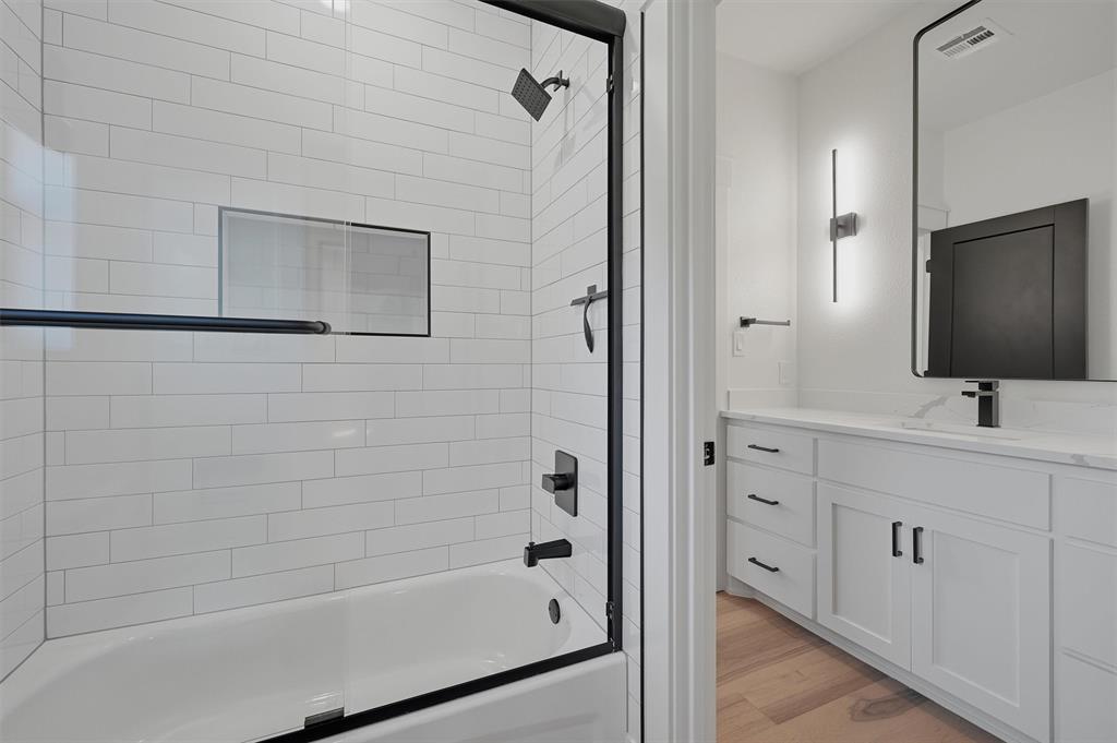 1805 Arthur Road Denison, TX 75021 - Photo 28 of 40 a bathroom with a shower and a sink