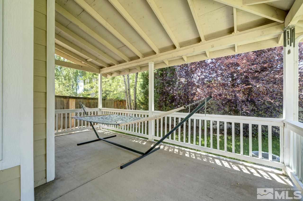 9721 Oakley Lane Reno, NV 89521 - Photo 6 of 40 a view of a porch with wooden floor