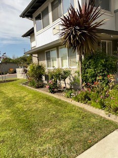 1860 St John Road Seal Beach, CA 90740 - Photo 2 of 10 a view of a house with a yard
