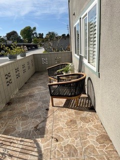 1860 St John Road Seal Beach, CA 90740 - Photo 3 of 10 a view of a two chair in the balcony