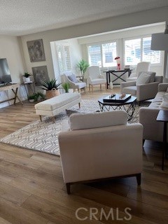 1860 St John Road Seal Beach, CA 90740 - Photo 4 of 10 a living room with furniture and a large window