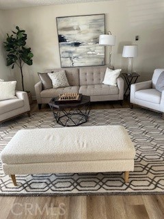 1860 St John Road Seal Beach, CA 90740 - Photo 7 of 10 a living room with furniture and a potted plant