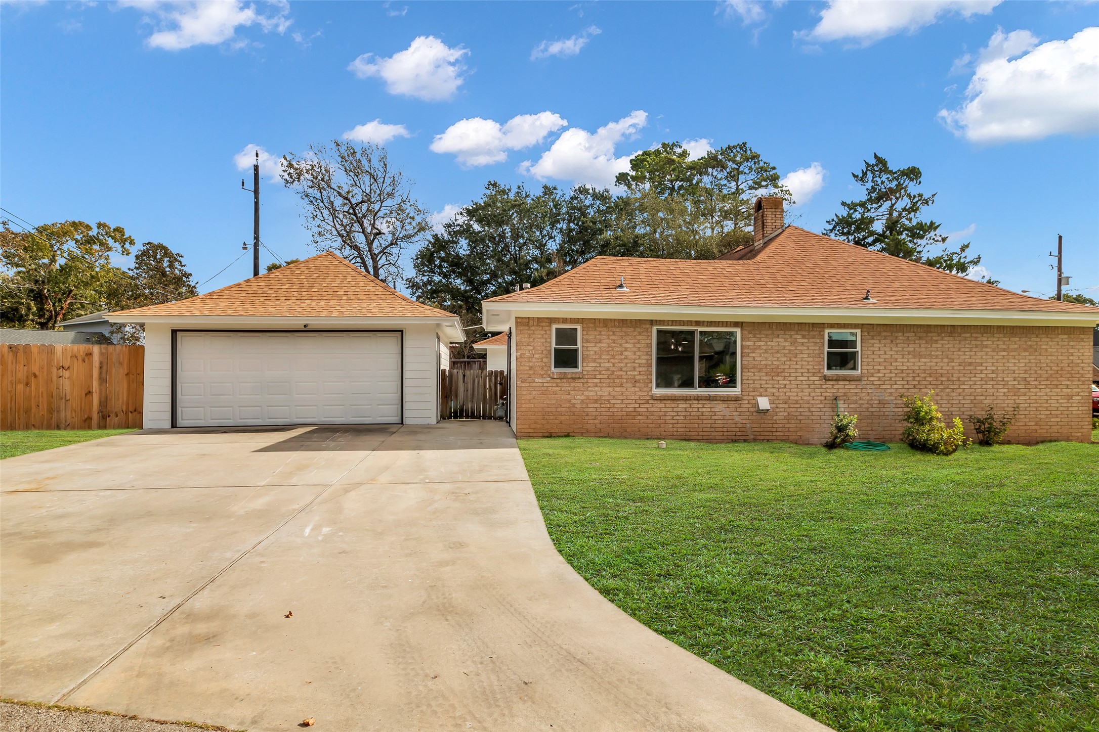 3518 Shore Shadows Drive Crosby, TX 77532 - Photo 30 of 42 a front view of a house with a yard and garage