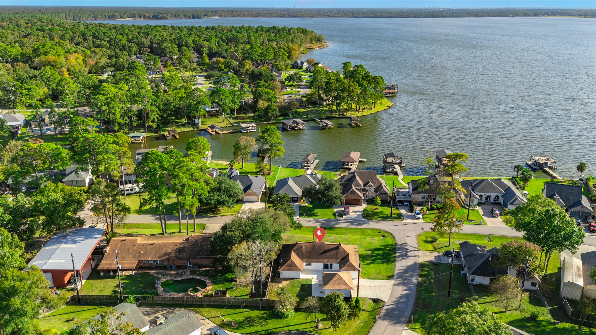 3518 Shore Shadows Drive Crosby, TX 77532 - Photo 38 of 42 an aerial view of a house with a lake view